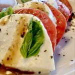 Caprese Salad salad of fresh mozzarella, tomatoes, and basil